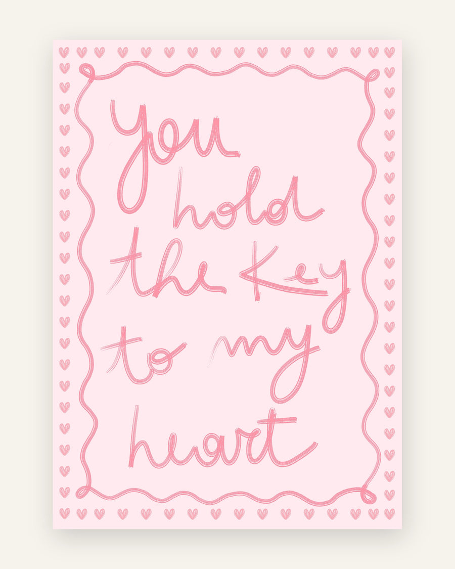 Børneplakat med you hold the key to my heart i lyserøde toner til pigeværelset